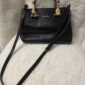 Black Crossbody Bag with Textured Surface and Structured Shape